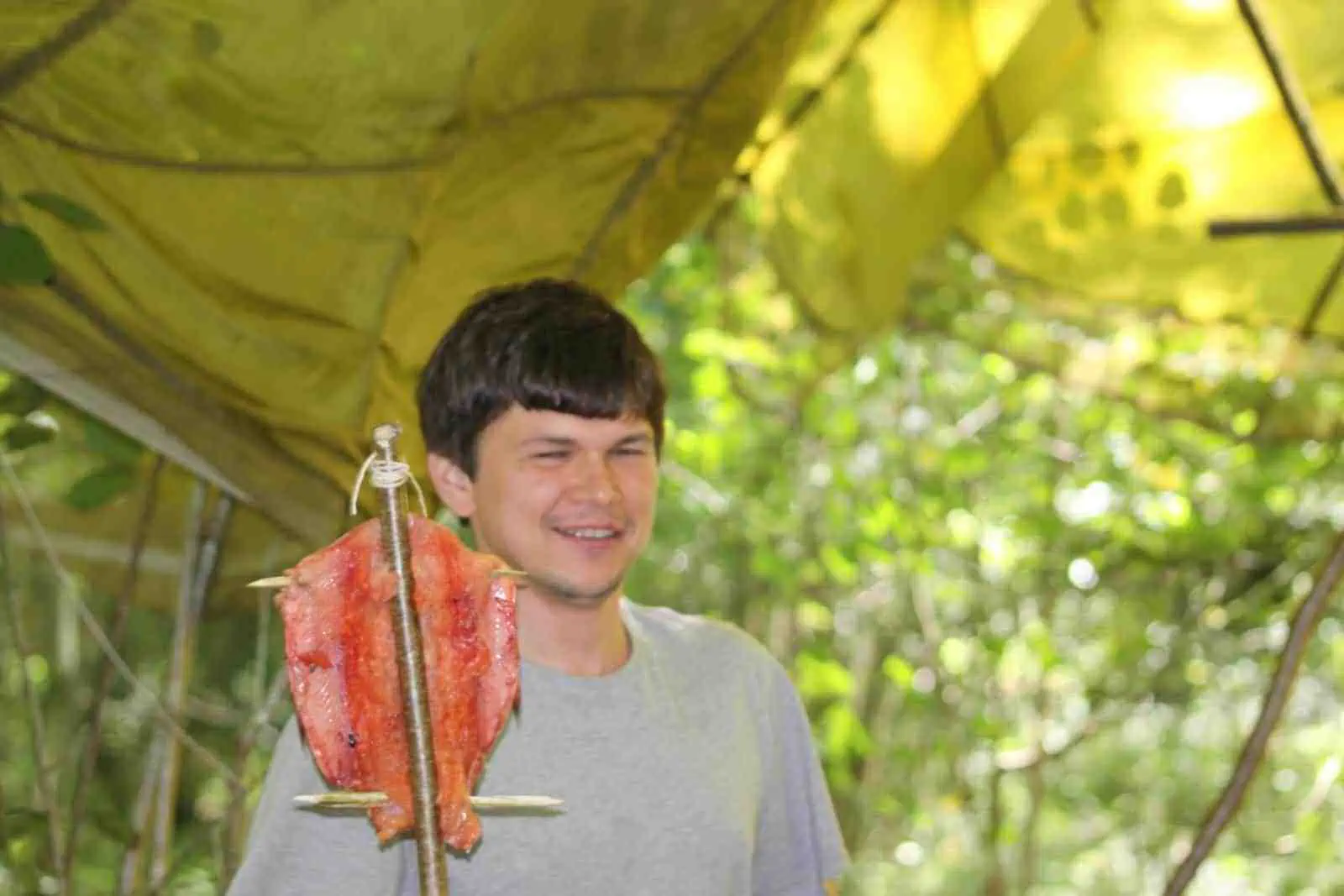 Cooking a fish in the wild