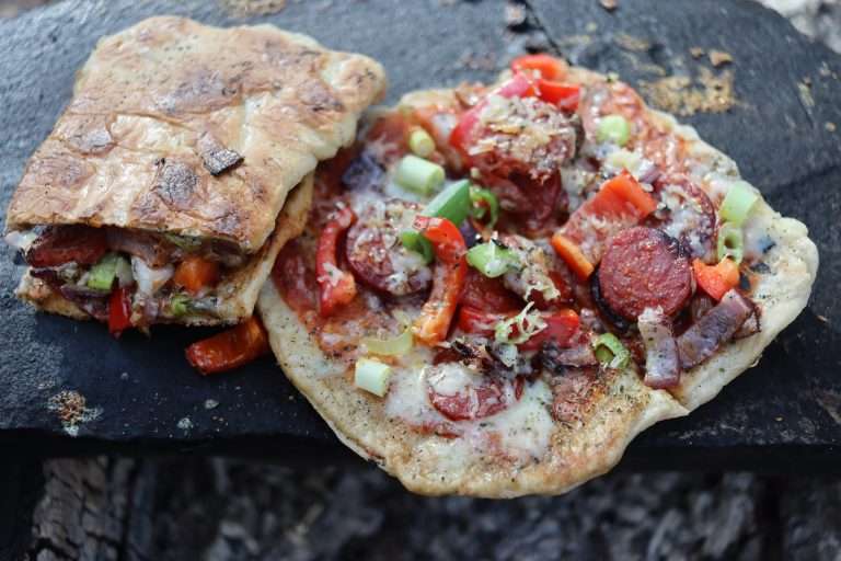 Campfire pizza on a rock